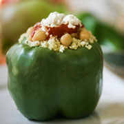 Couscous and garbanzo bean stuffed peppers with goat cheese