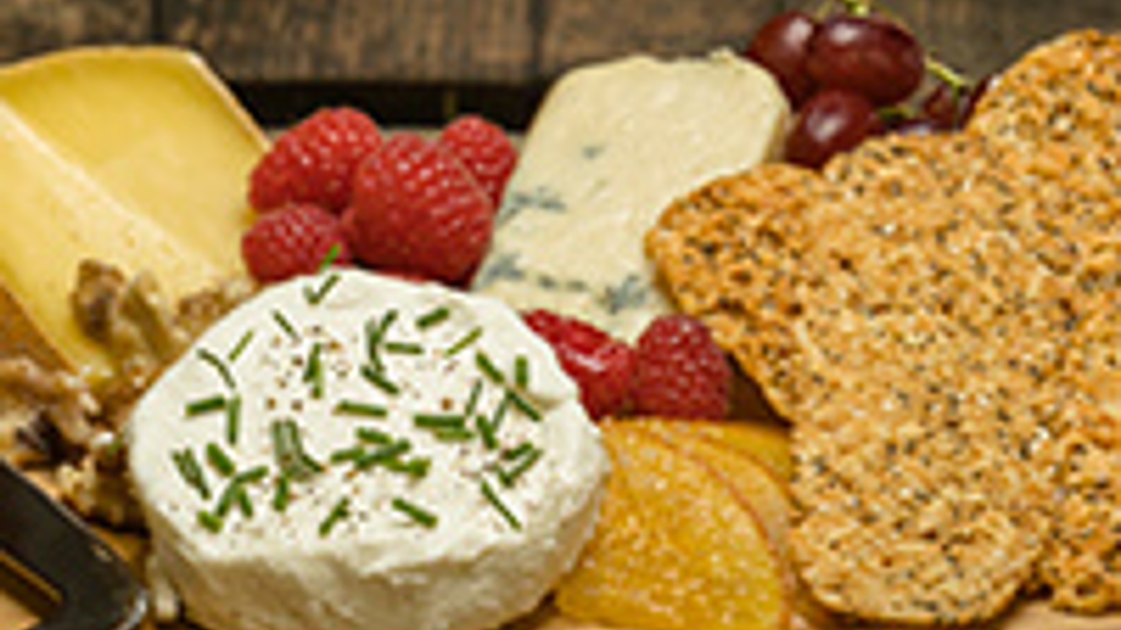 Festive cheese board with orange slices candied in white port