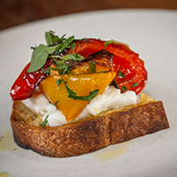 Marinated roasted pepper and burrata crostini