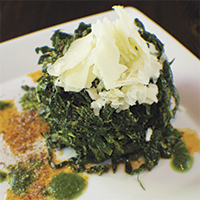 Black kale salad with toasted pistachio vinaigrette and Manchego cheese