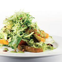 Escarole, frisee, acorn squash and spaghetti squash salad with pepita and coriander dressing