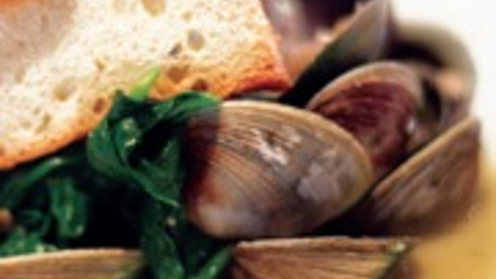 Steamed cockles with wilted arugula