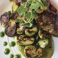 Grilled lamb sirloin chops with charred Brussels sprouts and mint chimichurri