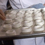 Mini meringue baskets filled with pomegranate sorbet