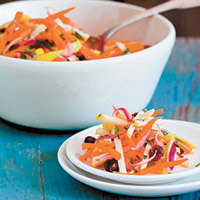 Carrot apple slaw with orange and cranberry