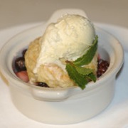 Wild berry cobbler with sweet butter milk biscuit and vanilla ice cream