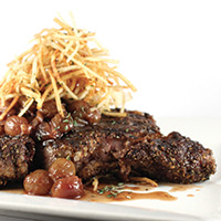 Rib-eye with grilled grape sauce and garlic herb shoestring potatoes