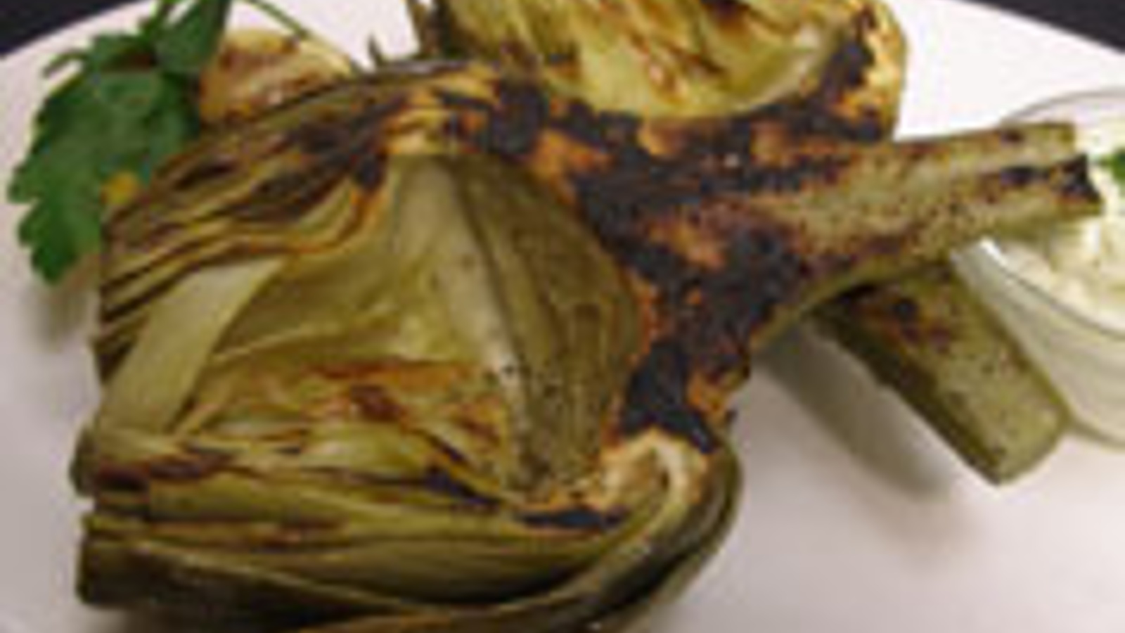 Grilled artichokes with pesto aioli