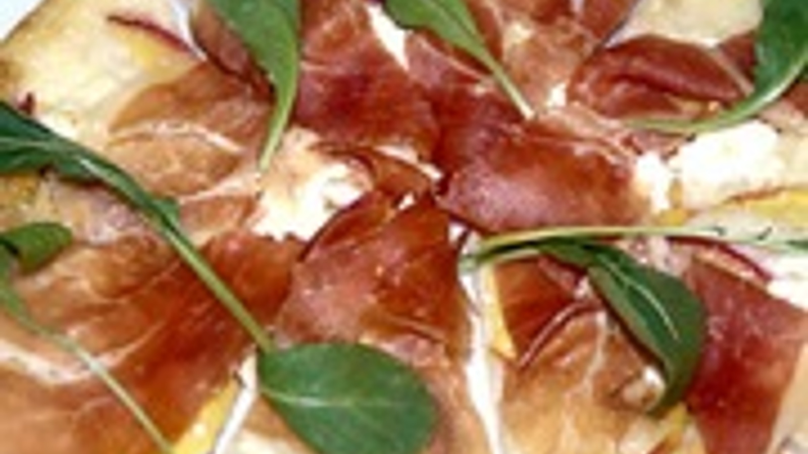 Flatbread (pizza) with peaches, farmers cheese, prosciutto and arugula