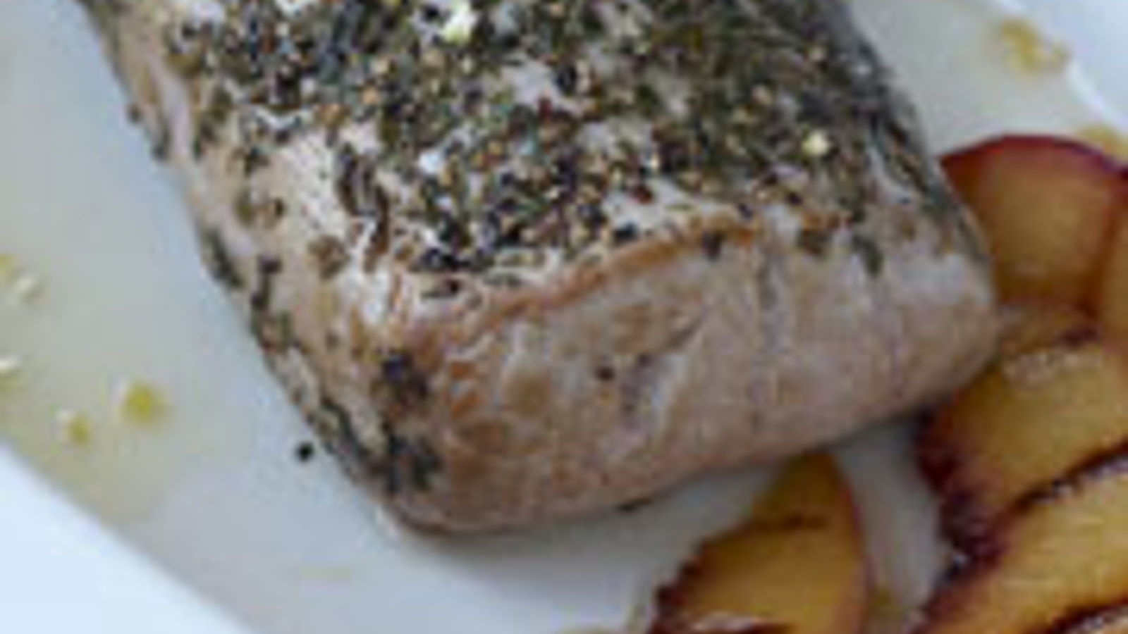 Herb roasted pork loin with grilled peaches and limoncello glaze