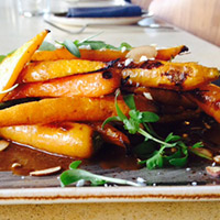 Oven-roasted baby carrots with mole sauce