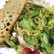 Mixed green salad with cherries, feta cheese and levain croutons