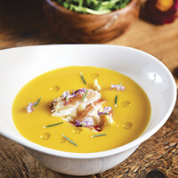 Kabocha squash soup with rosemary and Dungeness crab