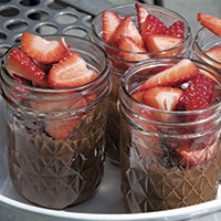 Chocolate pot de creme with fresh strawberries