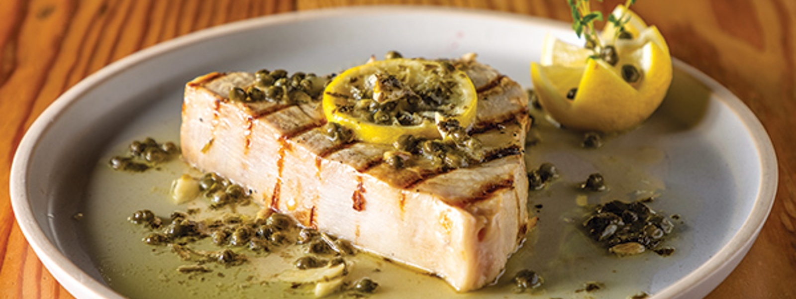 Grilled swordfish with lemon caper sauce