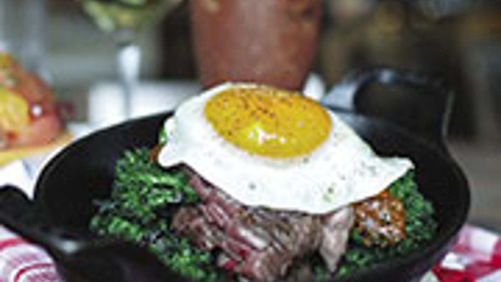 Brunch steak with chimichurri sauce and egg