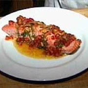 Baked salmon with tomato-basil sauce and fried garlic