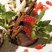 Classic chocolate-dipped strawberries with white and dark chocolate shavings