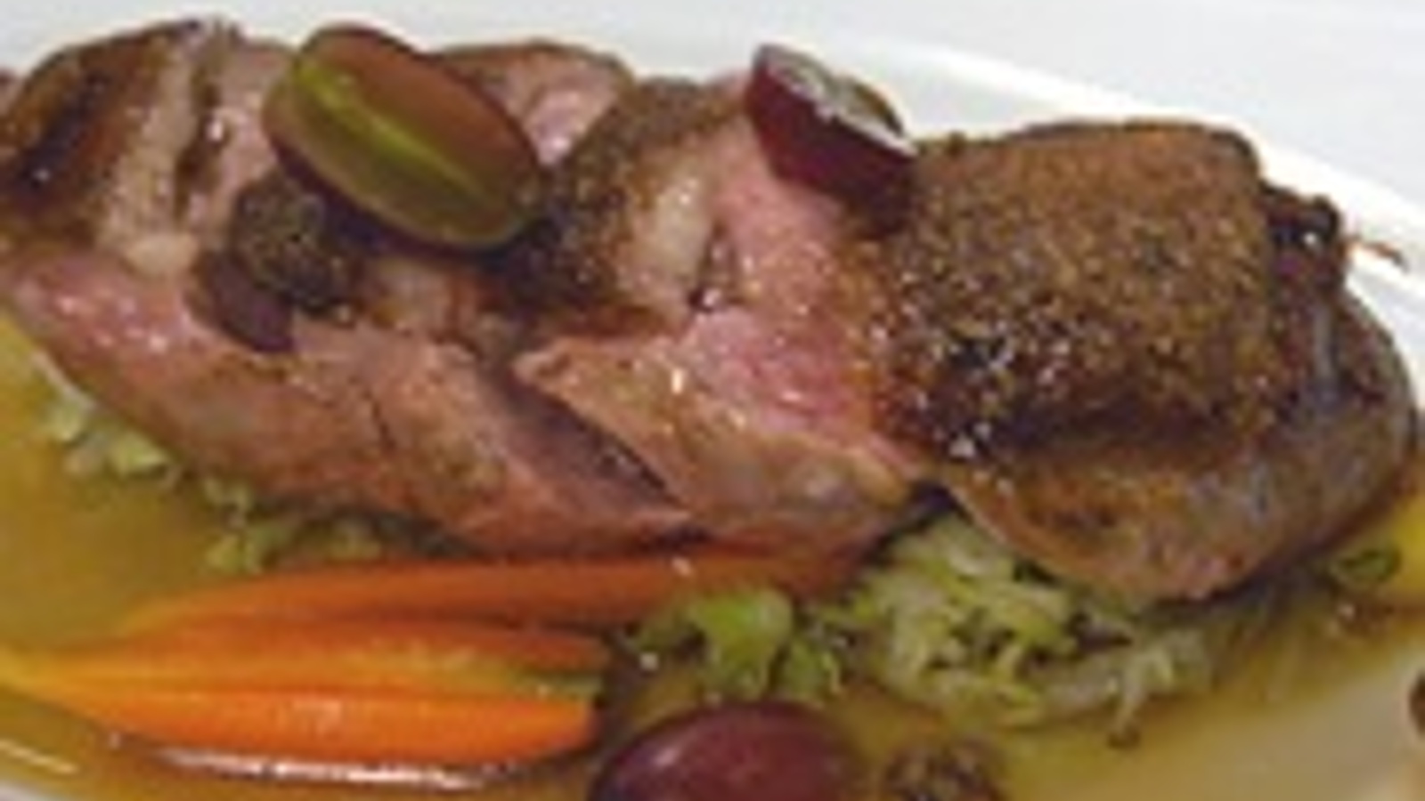 Duck breast with carrots, cabbage and grapes