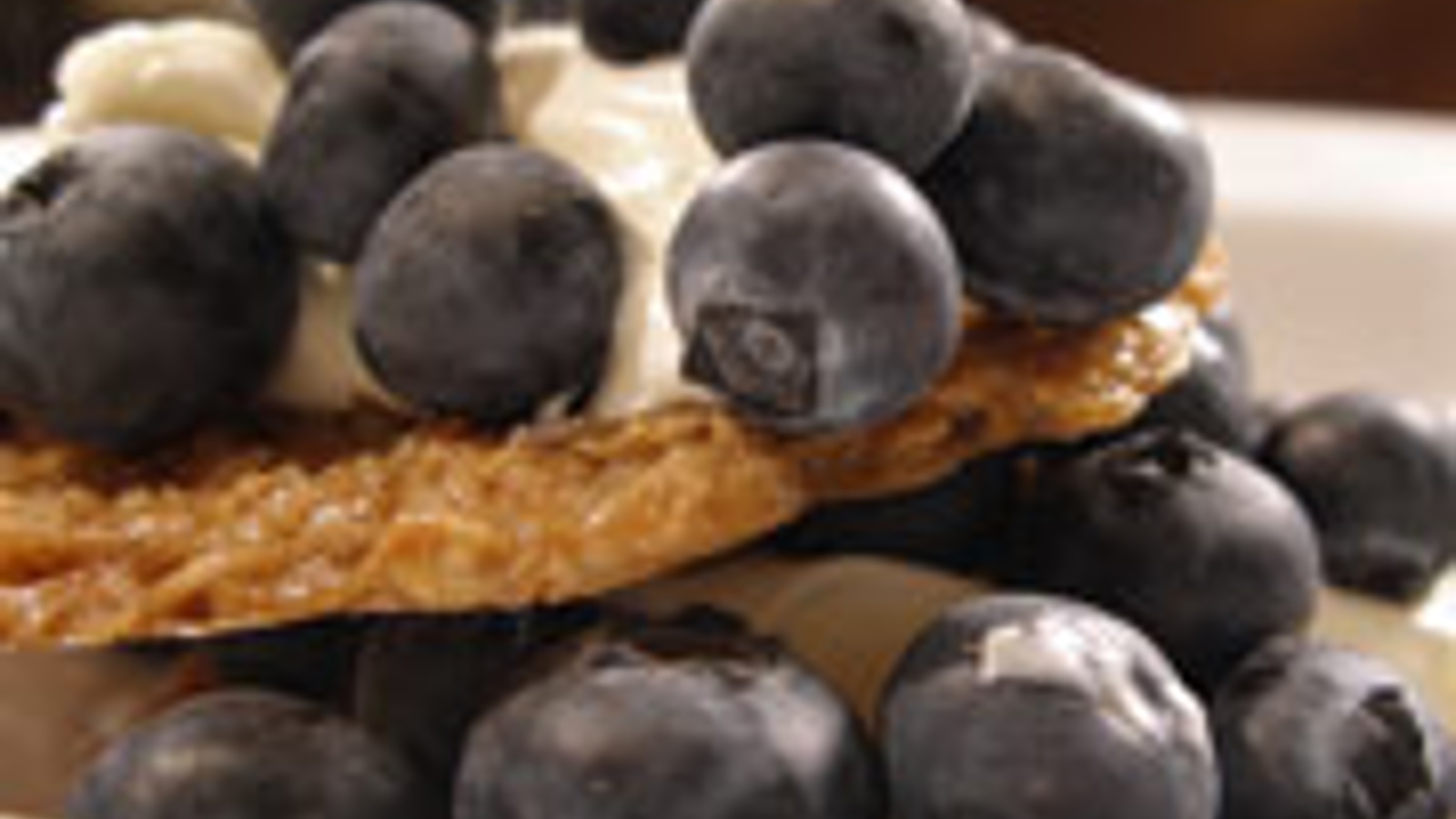 Oat crisps with blueberries and creme fraiche