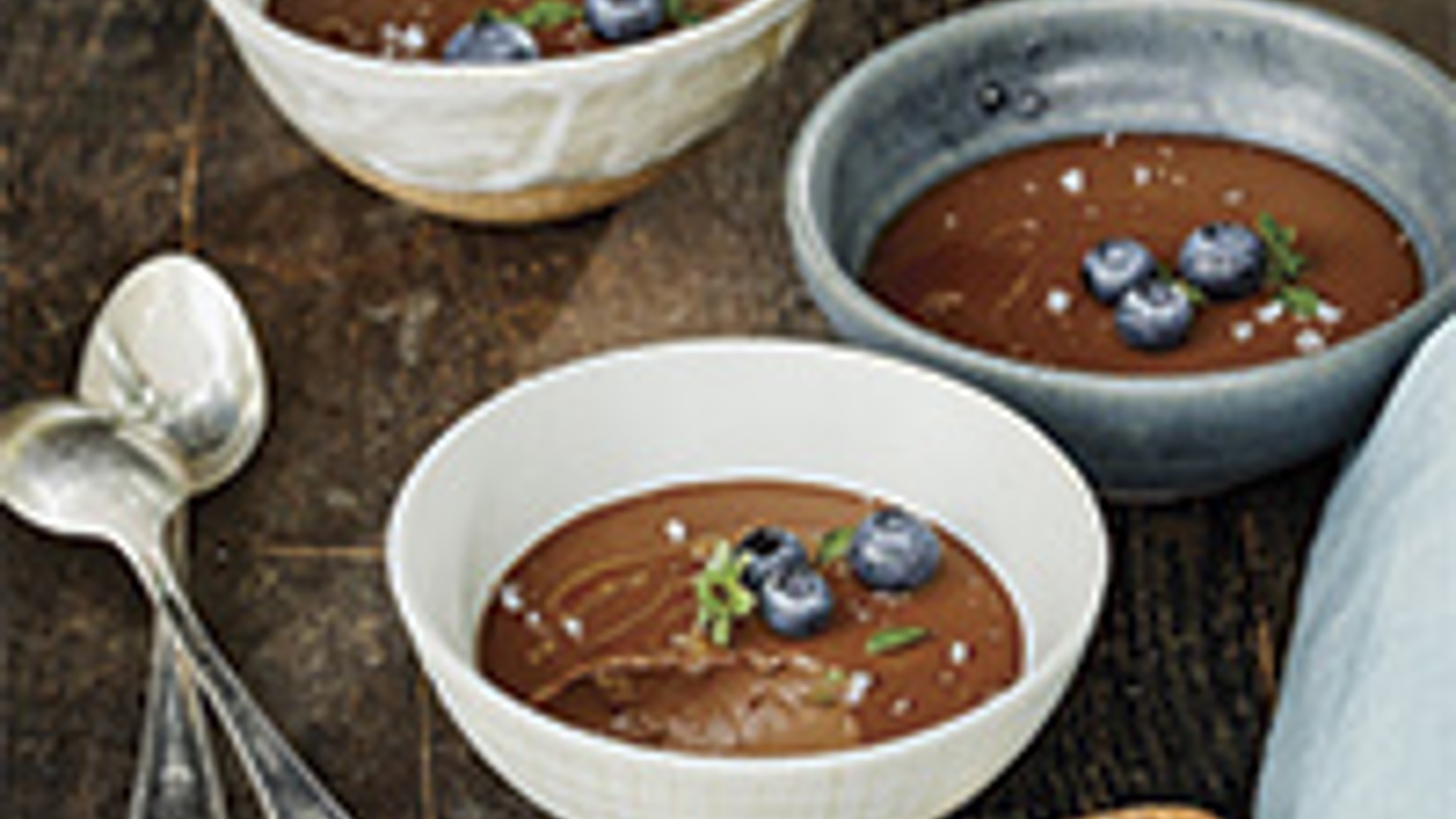 Dark chocolate budino with blueberries and basil