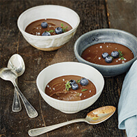 Dark chocolate budino with blueberries and basil