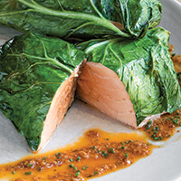 Collard wrapped salmon with Creole mustard sauce